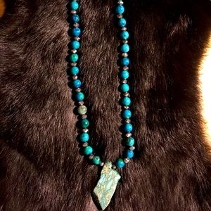 Blue/Gray beading with a Stone centerpiece